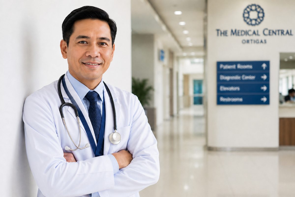 A physician standing in a hospital corridor.